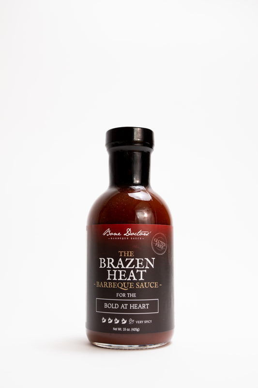 Bottle of tomato based 'The Brazen Heat' barbecue sauce on a white background
