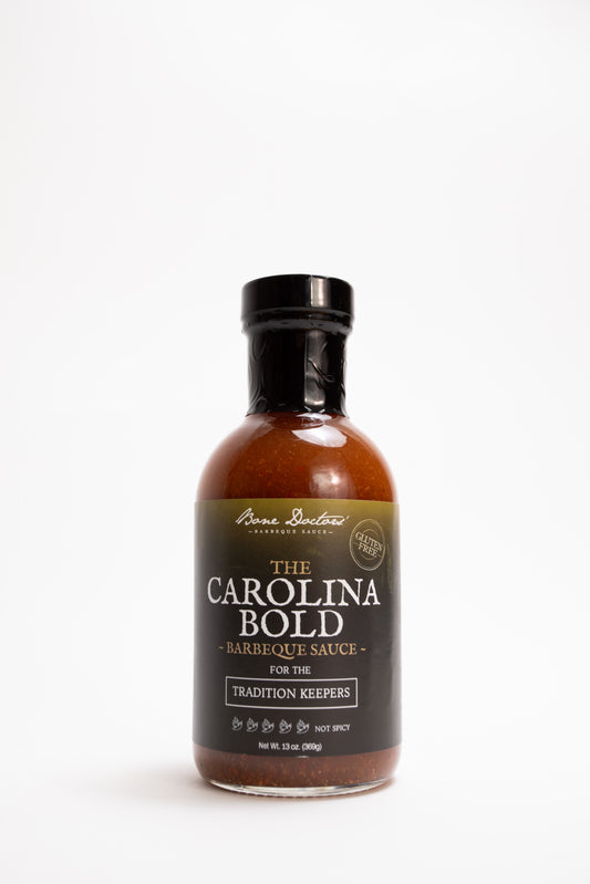 Bottle of vinegar-based Carolina Bold barbecue sauce on a white background