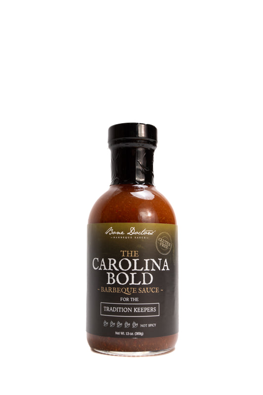 Bottle of vinegar-based Carolina Bold barbecue sauce on a white background