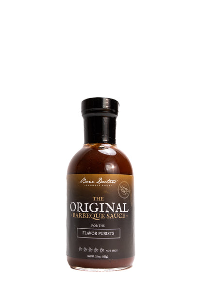 Bottle of tomato-based Bone Doctors' Original Barbeque Sauce on a white background